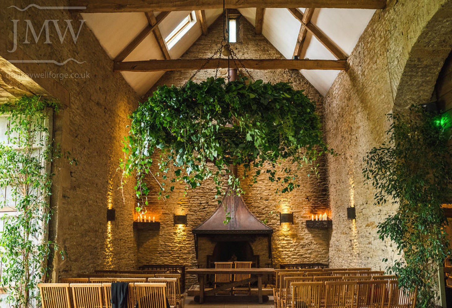stone-barn-wedding-venue-hanging-flower-ring-iron-donkeywell-forge