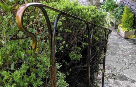 bronze-patina-handrail-forged-worked-iron-riveted