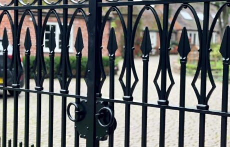 traditional-forged-ornate-driveway-entrance-gates-ironwork-iron-painted-scrollwork-railheads-finials-blacksmith-detail